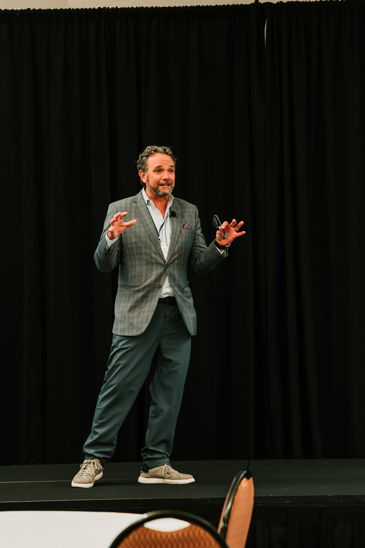 Speaker on stage during the 2025 Zenith Cost Containment Summit